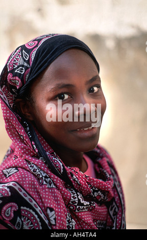Portrait of a young Zanzibari woman wearing a colourful kanga Stone Town Unguja Zanzibar Tanzania Stock Photo