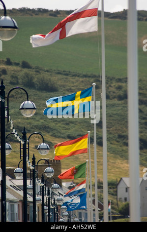 The flags of many countries flying in the wind, Aberystwyth Wales UK Stock Photo