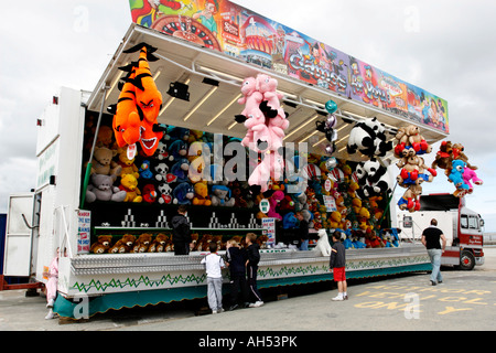 Hoylake Lifeboat Day mobile sideshow attraction showing prizes and contestants Stock Photo