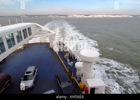 English Channel off Kent coast 2 two cars on ferry English white chalk cliffs distant Stock Photo