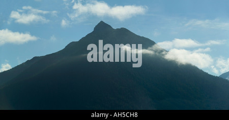 Arrowhead Peak 3275 ft silhouetted by early morning sunlight Sitka Alaska USA Stock Photo