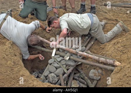 Building a Hangi, Earth Oven, at a Bushmoot. Stock Photo