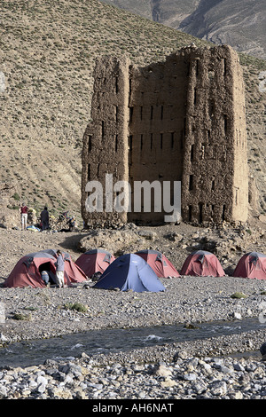 Trekking in Morocco hikers camp in front of Tighremt N ait Ahmed ruins of an ancient collective granary Stock Photo