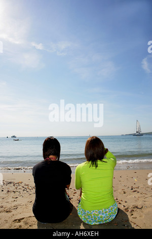 Two female models on the beach Stock Photo - Alamy