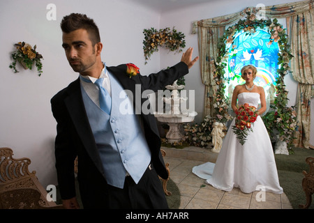 Groom leaving a bride at the altar Stock Photo