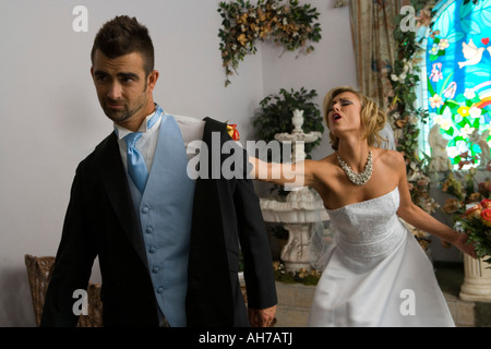 Groom leaving a bride at the altar Stock Photo