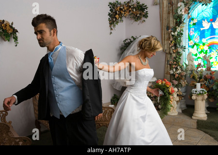 Groom leaving a bride at the altar Stock Photo