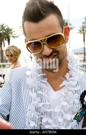 Close-up of a groom with a bride in the background Stock Photo