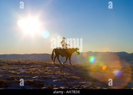 Silhouette of a man riding a horse Stock Photo