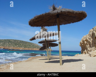 Parasol on mediterranean beach Balearic Island of Ibiza spain on hot sunny day with blue sky Stock Photo