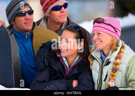 Two women smiling with two men standing behind them Stock Photo