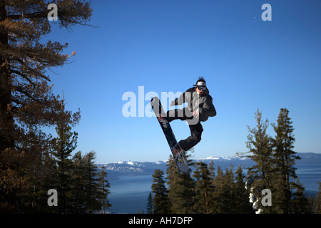 Young man snowboarding Stock Photo