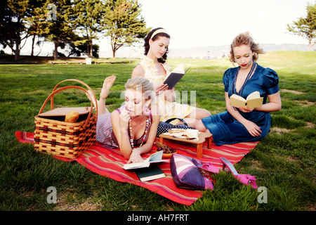 Three young women at a picnic Stock Photo