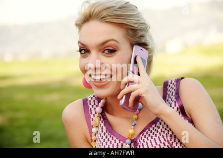 Portrait of a young woman talking on a mobile phone Stock Photo