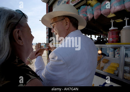 Senior couple looking at a digital camera Stock Photo