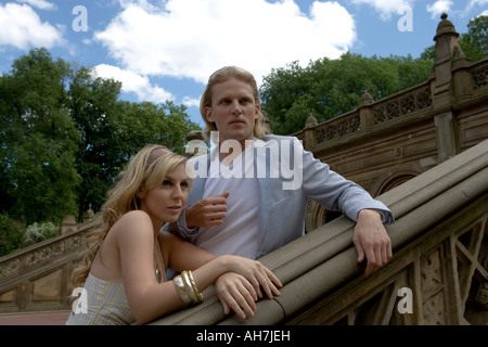 Young couple leaning against a bannister, Central Park, Manhattan, New York City, New York, USA Stock Photo