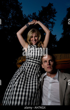 Young couple riding in a horsedrawn carriage Stock Photo