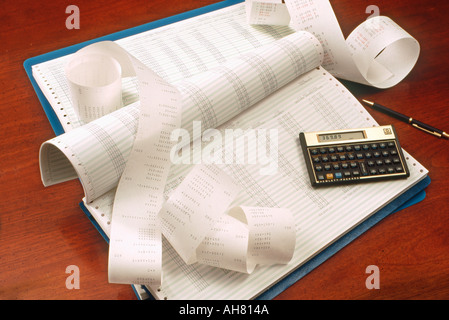 Ledger and calculator on desk for bookeeping Stock Photo