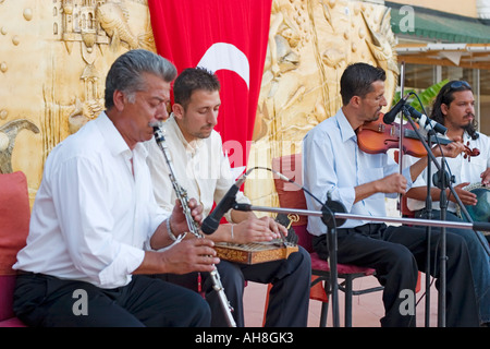 Turkish musicians perform using traditional instruments at hotel Stock Photo