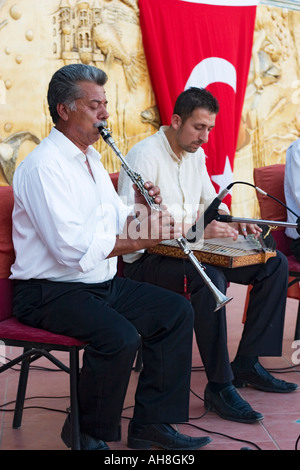 Turkish musicians perform using traditional instruments at hotel Stock Photo