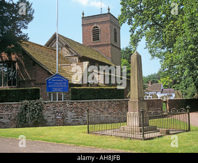 SWETTENHAM CHESHIRE England  UK June St Peters Church with the war memorial in the foreground Stock Photo