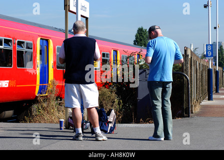 Train spotters at Clapham Junction railway station, London, England, UK Stock Photo