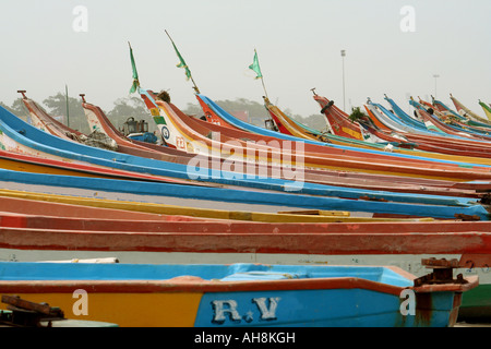 Colourful wooden fishing boats lined up on Marina Beach in Chennai, India Stock Photo