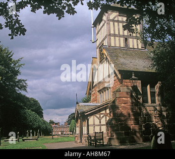 WHITMORE STAFFORDSHIRE UK August 12thc Church of St Mary and All Saints with unusual timber framed clock tower Stock Photo