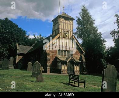 WHITMORE STAFFORDSHIRE England UK August 12thc Church of St Mary and All Saints with unusual timber framed clock tower Stock Photo