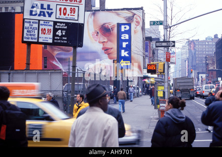 Street corner scene 24 St with a taxi New York City USA Stock Photo