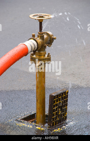 A fire hydrant in use Stock Photo