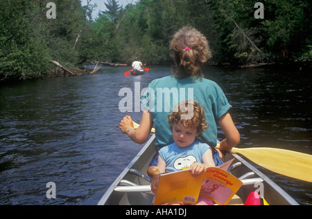 Mom and daughter on canoe trip Stock Photo