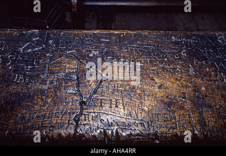 One of the famous desks at Eton College where students have carved their names for centuries, Eton, near Windsor, England UK Stock Photo