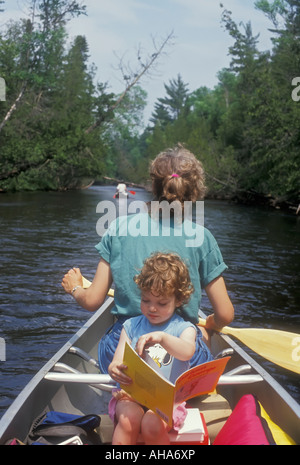 Mom and daughter on canoe trip Stock Photo