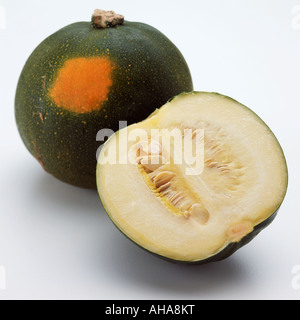 A whole and a half gem squash on a white background editorial food Stock Photo