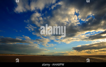 Dramatic sky over Brancaster beach in Norfolk. Stock Photo