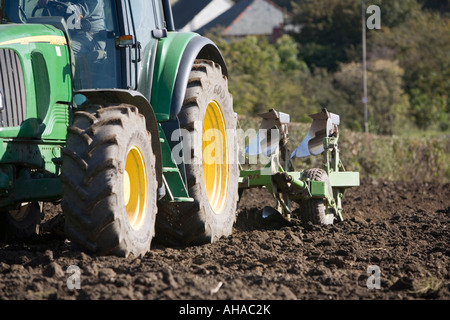 Tractor and plough October Stock Photo