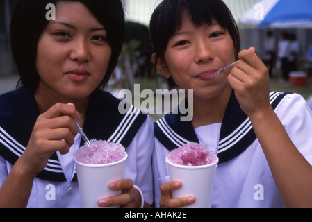 High school girl in uniform standing on grassland Stock Photo - Alamy