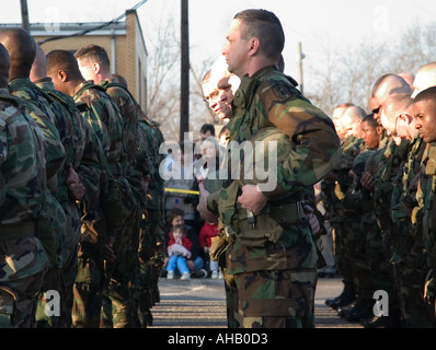 Soldiers Leaving for Deployment in Iraq Prepare for Prayer as Little Girl Looks on With Hands Clasped USA Stock Photo