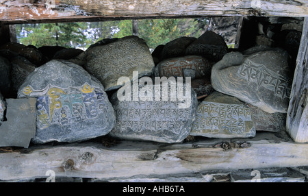 Buddhist mantras and sacred writings on stones in Pisang surroundings Annapurna Conservation area Nepal Stock Photo