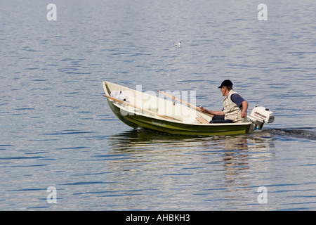 Man travelling in motorboat Stock Photo - Alamy