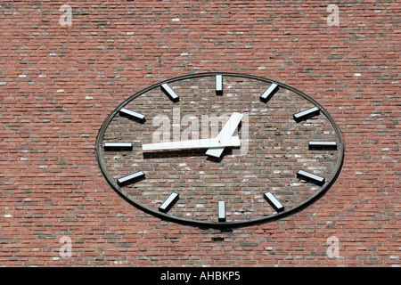 clock on red brick wall Stock Photo