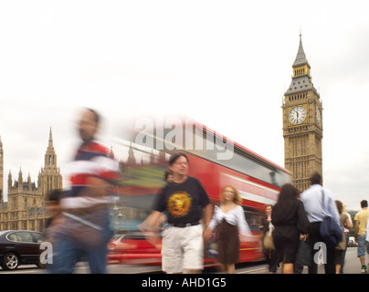 blurred tourist bus on Westminster Bridge in front of Big Ben and Houses of Parliament in London Stock Photo