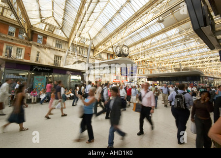 Waterloo station and blurred commuters on station concourse Stock Photo
