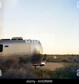 Mojave National Preserve California Airstream trailer at sunset in Hole In The Wall Campground Stock Photo