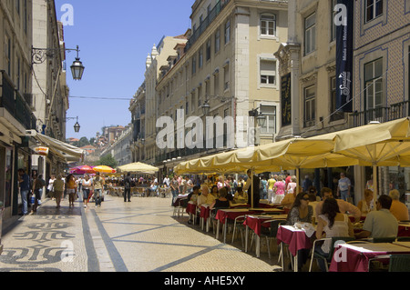 Lisbon Portugal Rua Augusta street in the baixa district looking towards Rossio, with street restaurants at lunchtime Stock Photo