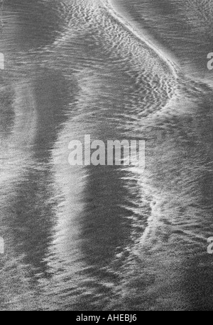 Sand Ripples on a Beach in Shades of Grey Stock Photo