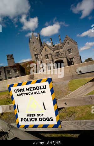 Dog patrol warning sign to deter trespassers at the empty house Golden Grove Gelli Aur near llandeilo Carmarthenshire Wales Stock Photo