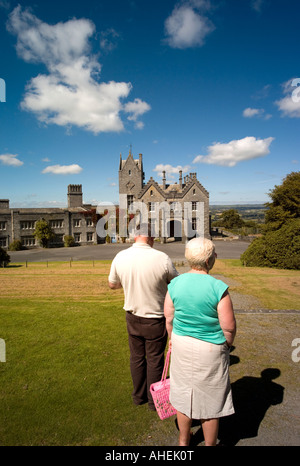 man and woman tourists at Golden Grove Gelli Aur house built 1826 - now abandoned  - near llandeilo Carmarthenshire August 2007 Stock Photo