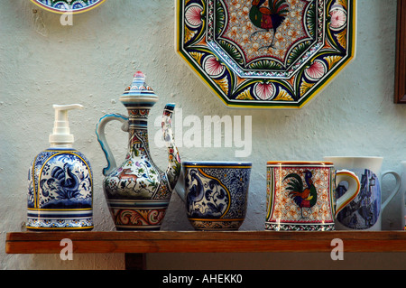 Traditional painted pottery and decorated ceramic for sale in a souvenir shop in Obidos a town and a municipality in the Oeste Subregion in Portugal Stock Photo